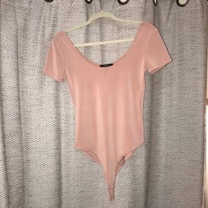 Salmon colored body suit